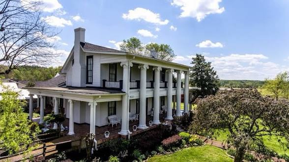 A side view of Loretta Lynn’s historic mansion and wraparound porch.