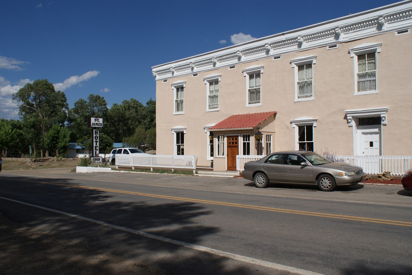 The St. James Hotel facade and roadside sign in Cimarron, photographed in August 2009.